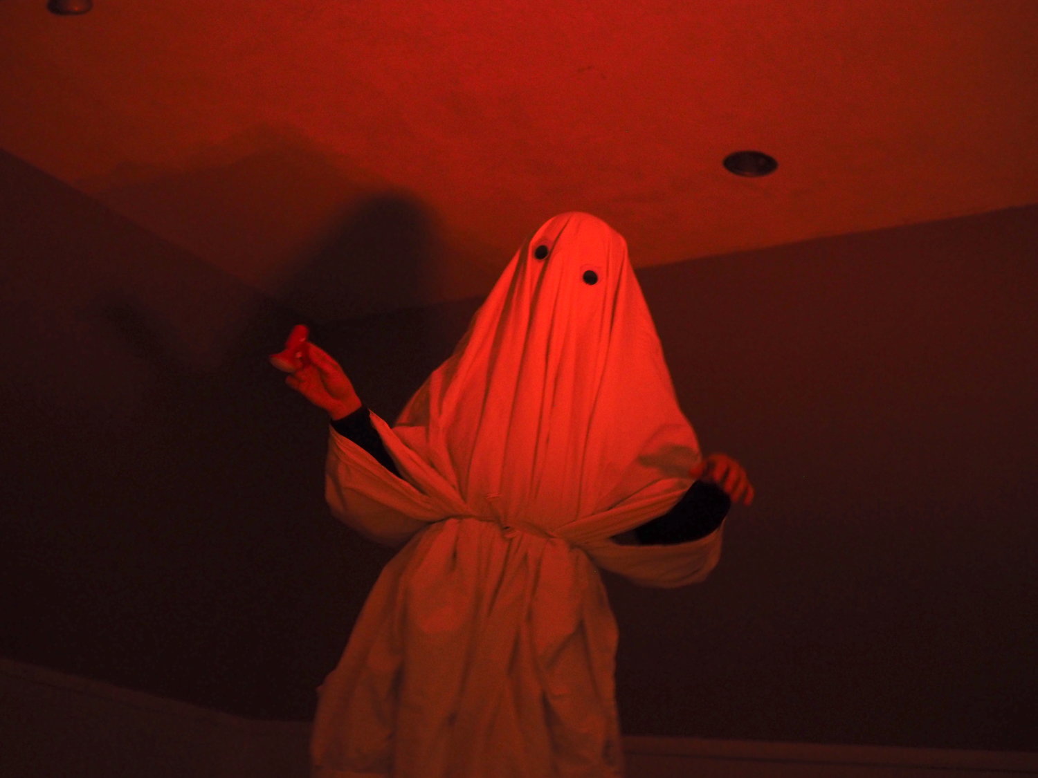 image of a sheet ghost bathed in red light